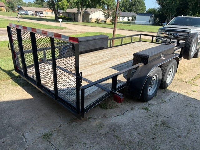 Precision utility trailer — rear 3/4 view with mesh gate and toolbox